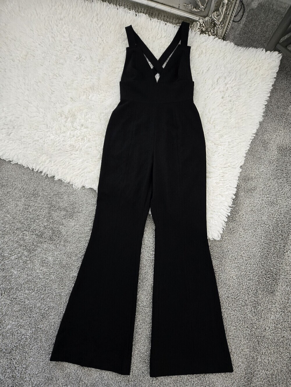 Gianni Bini Black Deep V neck Jumpsuit  fitted waist and wide-leg silhouette. 2.